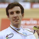 Britain's Simon Yates celebrates his gold medal during the men's points race at the 2013 UCI Track Cycling World Championships in Minsk, February 22, 2013.  REUTERS/Vasily Fedosenko