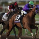 November 1, 2014; Santa Anita , CA, USA; Victor Espinoza aboard California Chrome sprints to the finish in race twelve during the 2014 Breeders Cup Championships at Santa Anita Park. California Chrome would finish second Mandatory Credit: Kelvin Kuo-USA TODAY Sports