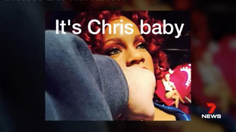 an image of a fist pretending to punch a wax model of pop star Rhianna with a caption on the photo reading "It's Chris baby"