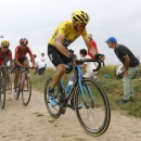 Team Sky rider Chris Froome of Britain (R) cycles on a cobble-stoned section during the 223.5-km (138.9 miles) 4th stage of the 102nd Tour de France cycling race from Seraing in Belgium to Cambrai, France, July 7, 2015.   REUTERS/Stefano Rellandini