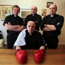 Irish Catholic priest Pierre 'Jalapeno' Pepper (front) poses with his backroom team in his church house St Rynaghs ahead of a boxing fight in Banagher, Republic of Ireland on March 14, 2015 (AFP Photo/Paul Faith)