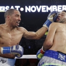 FILE - In this Nov. 16, 2013, file photo Andre Ward, left, lands a left to the head of Edwin Rodriguez, of the Dominican Republic, in the seventh round of their super middleweight championship boxing match in Ontario, Calif. Super Middleweight champion Andre Ward is ready for his 19-month layoff to come to an end Saturday, June 20, 2015, when he takes on England's Paul Smith in a non-title fight. (AP Photo/Reed Saxon, File)