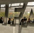 Journalists are reflected in a logo at the FIFA headquarters after a meeting of the executive committee in Zurich October 4, 2013.   REUTERS/Arnd Wiegmann