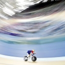 Bradley Wiggins pedals during his attempt to break cycling's hour record at the Olympic velodrome in East London, Britain, June 7, 2015. REUTERS/Andrew Winning