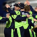 Ireland's cricketers celebrate after winning their Cricket World Cup Pool B match against Zimbabwe, at Bellerive Oval in Hobart, on March 7, 2015 (AFP Photo/Indranil Mukherjee)