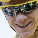 Britain's Chris Froome, wearing the overall leader's yellow jersey, smiles as he waits for the start of the thirteenth stage of the Tour de France cycling race over 198.5 kilometers (123.3 miles) with start in Muret and finish in Rodez, France, Friday, July 17, 2015. (AP Photo/Laurent Cipriani)