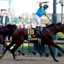 May 2, 2015; Louisville, KY, USA; Victor Espinoza aboard American Pharoah celebrates winning the 141st Kentucky Derby at Churchill Downs. Mandatory Credit: Peter Casey-USA TODAY Sports