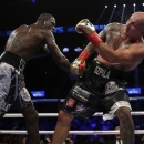 Jan 16, 2016; Brooklyn, NY, USA; Deontay Wilder (black and white shorts) and Artur Szpilka (black shorts) box during their heavyweight title boxing fight at Barclays Center. Wilder defeated Szpilka via ninth round knockout. Mandatory Credit: Adam Hunger-USA TODAY Sports