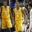 FILE - In this March 13, 2015, Tennessee forward Armani Moore (4) reacts against Arkansas during the first half of an NCAA college basketball game in the quarterfinal round of the Southeastern Conference tournament in Nashville, Tenn. Moore's college career has taught him plenty about how to adjust to change. The 6-foot-5 forward plans to apply those lessons in his senior as he leads a team adjusting to its third coach in as many seasons. (AP Photo/Mark Humphrey, File)