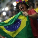 2016 Rio Olympics - Swimming - Preliminary - Heats - Olympic Aquatics Stadium - Rio de Janeiro, Brazil - 06/08/2016. A fan waves a Brazil flag to cheer on the team. REUTERS/Marcos