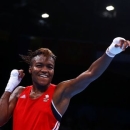 Nicola Adams (L) of Britain reacts after winning her 51kg women's Fly weight boxing final fight at the 1st European Games in Baku, Azerbaijan, June 25 , 2015.   REUTERS/Stoyan Nenov