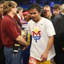 Manny Pacquiao of the Philippines leaves the ring after losing to Floyd Mayweather, Jr. of the U.S. in their welterweight WBO, WBC and WBA (Super) title fight in Las Vegas, Nevada, May 2, 2015.    REUTERS/Steve Marcus