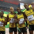 Jamaica's team (L-R) Nesta Carter, Asafa Powell, Nickel Ashmeade and Usain Bolt pose for photographers after winning the men's 4 x 100 metres relay final during the 15th IAAF World Championships at the National Stadium in Beijing, China, August 29, 2015.           REUTERS/Kai Pfaffenbach