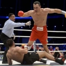 Ukrainian WBA, WBO, IBO and IBF heavyweight boxing world champion Vladimir Klitschko knocks down his challenger Bulgarian Kubrat Pulev during their title fight in Hamburg, November 15, 2014.     REUTERS/Fabian Bimmer