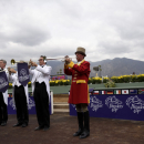 Buglers warm up before the start of the Breeders Cup horse races Friday, Oct. 31, 2014 at Santa Anita Park in Arcadia, Calif. (AP Photo/Jae C. Hong)