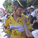 A doctor examines the broken collar bone of Germany's Tony Martin, after a crash in the last kilometers of the sixth stage of the Tour de France cycling race over 191.5 kilometers (119 miles) with start in Abbeville and finish in Le Havre, France, Thursday, July 9, 2015. Left is Poland's Michal Kwiatkowski. (AP Photo/Eric Feferberg, Pool)