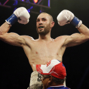 Jose Pedraza celebrates defeating Andrey Klimov during the IBF junior lightweight title boxing match, Saturday, June 13, 2015, in Birmingham, Ala. (AP Photo/Brynn Anderson)