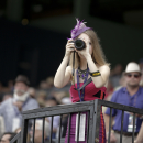 A fan takes a picture at Santa Anita Park before the Breeders Cup horse races Friday, Oct. 31, 2014, in Arcadia, Calif. (AP Photo/Jae C. Hong)