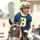 In a photo provided by Benoit Photo, jockey Mike Smith guides Gabriel Charles to the winner's circle after their victory in the Grade I, $400,000 Eddie Read Stakes horse race, Saturday, July 18, 2015, at Del Mar Thoroughbred Club in Del Mar, Calif. (Benoit Photo via AP)