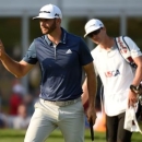 Jun 19, 2016; Oakmont, PA, USA; Dustin Johnson waves to the crowd after putting on the 13th green during the final round of the U.S. Open golf tournament at Oakmont Country Club. Mandatory Credit: John David Mercer-USA TODAY Sports