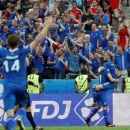 Iceland's Arnor Ingvi Traustason celebrates with Birkir Bjarnason after scoring the second goal. REUTERS/Christian Hartmann