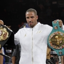 FILE - In this Nov. 16, 2013, file photo, Andre Ward holds up his championship belts after his defeat of Edwin Rodriguez, of the Dominican Republic, in their super middleweight championship boxing match in Ontario, Calif. Super Middleweight champion Andre Ward is ready for his 19-month layoff to come to an end Saturday, June 20, 2015, when he takes on England's Paul Smith in a non-title fight. (AP Photo/Reed Saxon, File)