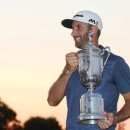 Jun 19, 2016; Oakmont, PA, USA; Dustin Johnson poses with the championship trophy after winning the U.S. Open golf tournament at Oakmont Country Club. Mandatory Credit: Charles LeClaire-USA TODAY Sports