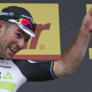 Team Dimension Data rider Mark Cavendish of Britain reacts on podium after winning the stage. REUTERS/Juan Medina