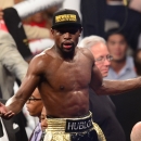 Floyd Mayweather Jr. gestures after defeating Manny Pacquiao on May 2, 2015 in Las Vegas, Nevada (AFP Photo/Frederic J. Brown)