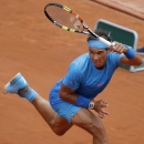 Spain's Rafael Nadal returns in the first round match of the French Open tennis tournament against Quentin Halys of France at the Roland Garros stadium, in Paris, France, Tuesday, May 26, 2015. Nadal won in three sets 6-3, 6-3, 6-4. (AP Photo/Michel Euler)