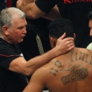 Fritz Sdunek, coach of WBC heavyweight world boxing champion Vitali Klitschko, comforts Odlanier Solis of Cuba after Solis' fight against Klitschko in Cologne March 19, 2011.   REUTERS/Ralph Orlowski