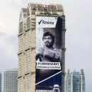 In this Friday, May 8, 2015 photo, a billboard ad on Filipino boxer Manny Pacquiao hangs on a tall building along a busy avenue known as EDSA at suburban Mandaluyong city, east of Manila, Philippines. Pacquiao lost his biggest fight in the ring, but that won't stop him from plotting a bigger comeback - in the political arena that is. Many Filipinos see Pacquiao's loss as his cue to retire from boxing. For them, Pacquiao has already sealed his legacy not just as one of the world's greatest boxers but also as a source of national pride. Others want him to also withdraw from politics and enjoy the fruits of his 20-year boxing career. (AP Photo/Bullit Marquez)