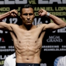 Francisco Vargas poses for the media after the official weigh-in for his Saturday bout against Juan Manuel Lopez, Friday, July 11, 2014, in Las Vegas. (AP Photo/Chris Carlson)