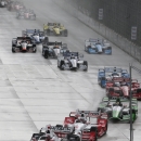 Helio Castroneves leads the field during the first race of the IndyCar Detroit Grand Prix auto racing doubleheader Saturday, May 30, 2015, in Detroit. (AP Photo/Dave Frechette)