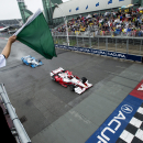 Simon Pagenaud leads Juan Pablo Montoya as they race past the start line during the Honda Toronto IndyCar race in Toronto on Sunday, June 14, 2015. (Nathan Denette(/The Canadian Press via AP) MANDATORY CREDIT