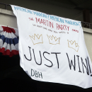 A banner supporting American Pharoah hangs from the upper deck before the 147th running of the Belmont Stakes horse race at Belmont Park, Saturday, June 6, 2015, in Elmont, N.Y. American Pharoah will try for a Triple Crown when he runs in Saturday's race. (AP Photo/Jason DeCrow)