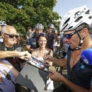 Lance Armstrong signs autographs at the arrival of the charity ride 