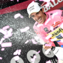 Spain's Alberto Contador wears the pink jersey of the overall leader as he celebrates on the podium after completing the 15th stage of the Giro d'Italia, Tour of Italy cycling race from Marostica to Madonna di Campiglio, Italy, Sunday, May 24, 2015. Spain's Mikel Landa won the stage after an attack on the final steep section of the climb up to the Madonna Di Campiglio ski resort to claim his first Grand Tour stage victory. (Daniel Dal Zennaro/ANSA via AP)