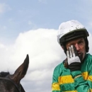 A.P McCoy wipes away a tear after finishing third in the Handicap Hurdle Race, his last ever competitive race. Reuters / Eddie Keogh