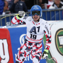 Matthias Mayer of Austria, celebrates at finish line after winning an alpine ski World Cup men's downhill event, in Saalbach Hinterglemm, Austria, Saturday, Feb. 21, 2015. (AP Photo/Giovanni Auletta)