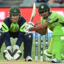 Ahmed Shehzad of Pakistan (R) hits a shot as Ireland wicketkeeper Gary Wilson looks on during the 2015 Cricket World Cup Pool B match at the Adelaide Oval on March 15, 2015 (AFP Photo/Peter Parks)