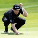 Jun 19, 2016; Oakmont, PA, USA; Branden Grace lines up a putt on the 2nd green during the final round of the U.S. Open golf tournament at Oakmont Country Club. Mandatory Credit: Michael Madrid-USA TODAY Sports