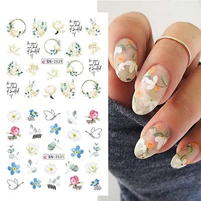 Female hand with spring nail design. White nail polish manicure. Female  model hand with perfect manicure hold white tulip flowers on towel  background - Stock Image - Everypixel