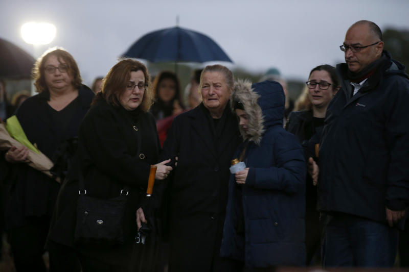 Mourners gather at the park dressed in dark clothing to honour Courtney.