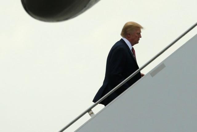 President Trump boards Air Force One to return to Washington, D.C., after spending the weekend at the Mar-a-Lago Club in West Palm Beach, Fla., earlier this month. (Jonathan Ernst/Reuters)