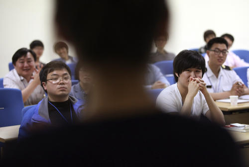 FILE - In this May 5, 2012 file photo, South Korean cyber activists listen to North Korean defector Lee Mi-yeon, back to camera, during her lecture on national cyber security at Ministry of Patriots and Veterans Affairs in Suwon, South Korea. Most North Koreans have never even seen the Internet. But the country Washington suspects is behind a devastating hack on Sony Pictures Entertainment has managed to orchestrate a string of crippling cyber infiltrations of South Korean computer systems in recent years, officials in Seoul believe, despite North Korea protesting innocence. (AP Photo/Ahn Young-joon, File)