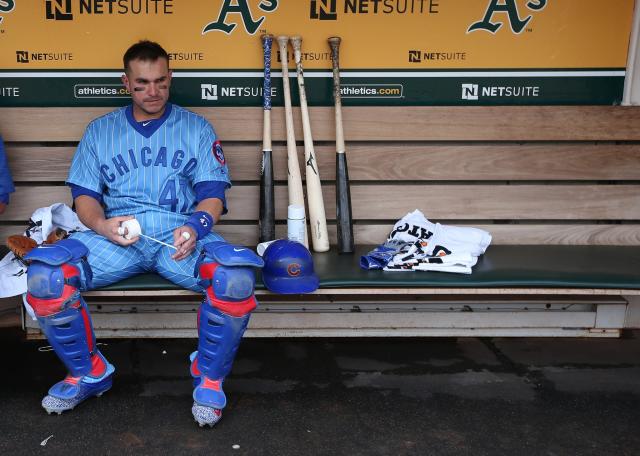 Miguel Montero #47 of the Chicago Cubs gets ready in the dugout before the game against the Oakland Athletics at the Oakland Coliseum on Saturday, August 6, 2016 in Oakland, California.