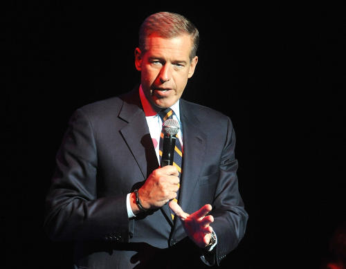 FILE - In this Nov. 5, 2014, file photo, Brian Williams speaks at the 8th Annual Stand Up For Heroes, presented by New York Comedy Festival and The Bob Woodruff Foundation in New York. Suspended NBC News anchor Williams and his wife attended a fundraiser, Saturday, March 21, 2015, and donated $50,000 in a bid to keep his Catholic high school in New Jersey, Mater Dei Prep, from closing. The school announced in February it will close in June because of financial problems unless it can raise $1 million. (Photo by Brad Barket/Invision/AP, File)