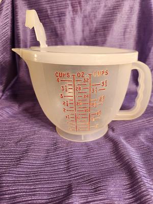 2/3 cup coffee in Tupperware measuring cup