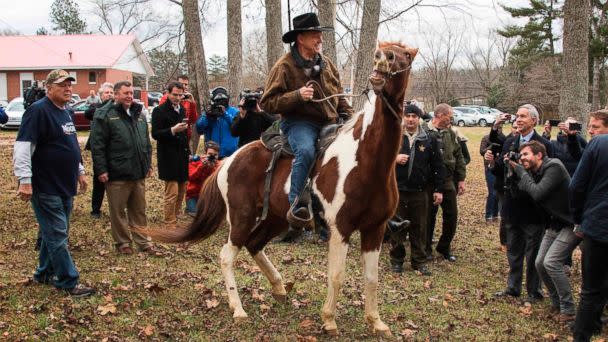 PHOTO: Republican senatorial candidate Roy Moore departs on his horse at the polling station after voting in Gallant, Ala., Dec. 12, 2017. (Jim Watson/AFP/Getty Images)